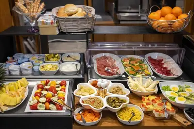 a buffet line with many different types of food at Concept Terrace Hotel in Rome