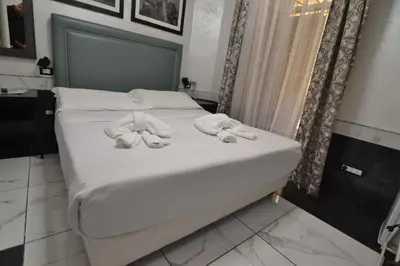 a bed with towels on it in a room at Popolo Relax in Rome