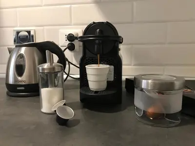 a kitchen counter with a coffee maker and a blender at Appartamento in via Licia in Rome