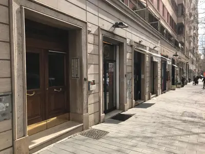 a row of doors on the side of a building at Appartamento in via Licia in Rome