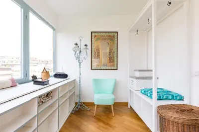 a white room with a desk and a chair at Rome Top floor with Terrace in Rome