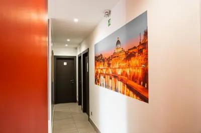 a hallway with a painting on the wall at Le Terrazze di San Giovanni in Rome