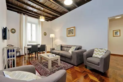 a living room with a couch and chairs and a table at Pellegrino in Rome
