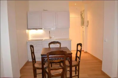 a kitchen with a table and chairs in a room at Central quiet apartment and terrace in Rome