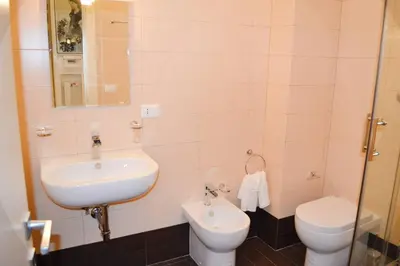 a bathroom with a sink and a toilet at Central quiet apartment and terrace in Rome