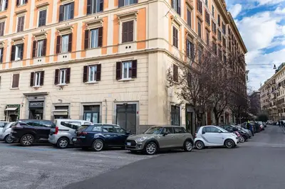 a row of cars parked in front of a building at Casa Linnea in Rome
