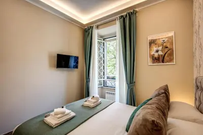 a bedroom with a bed and a window at Dimore Vespasiano in Rome