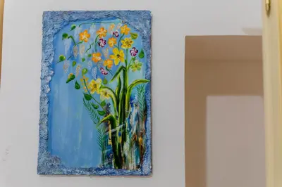 a painting of a vase of flowers on a wall at Oscar 3 in Rome