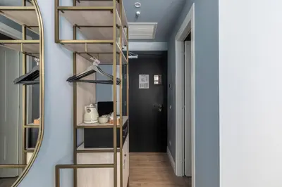 a bathroom with a shower and a toilet and a sink at Numa Rome Linea in Rome