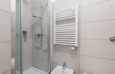 a bathroom with a shower and a toilet and a sink at Quiet with large terrace in Spanish Steps area in Rome
