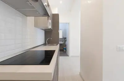 a kitchen with a sink and a counter top at Quiet with large terrace in Spanish Steps area in Rome