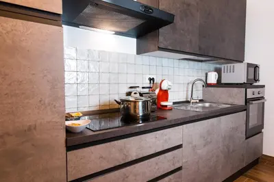a kitchen with a sink and a stove at Angelina Apartment Roma Monteverde in Rome