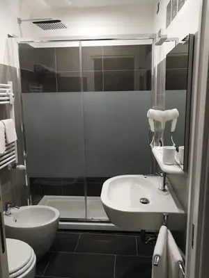 a bathroom with a shower and a sink and a toilet at Da Angelica in Rome
