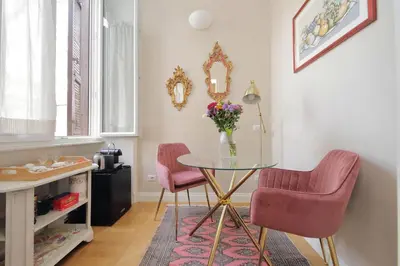 a bathroom with a sink and a mirror at Beautiful suite in the heart of Trastevere in Rome