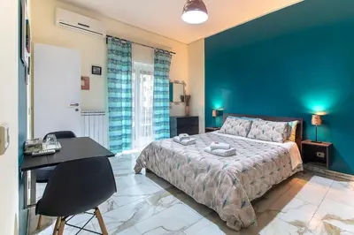 a bedroom with a bed and a table and a desk at Bed and Breakfast Zoe holiday in Rome