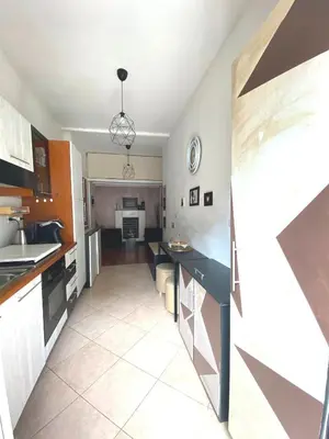 a kitchen with black counter tops and an open floorplan at Bed and Breakfast Zoe holiday in Rome