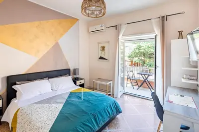 a bedroom with a bed and a balcony at Bed and Breakfast Zoe holiday in Rome