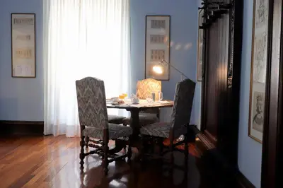 a dining room with a table and two chairs at Trevi Suite B&B in Rome