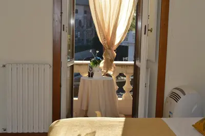 a room with a table and a window at Balcony Colosseum View in Rome