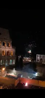 a view of a city at night with lights at Balcony Colosseum View in Rome