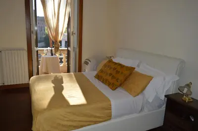 a bedroom with a bed with a shadow of a person at Balcony Colosseum View in Rome