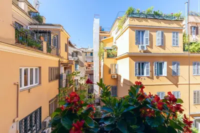 a view of buildings in a city with flowers at Domus De Fiori in Rome