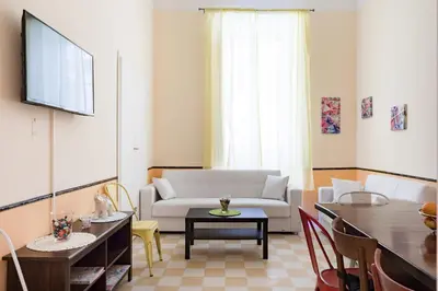 a living room with a couch and a table at Casa al Viminale in Rome