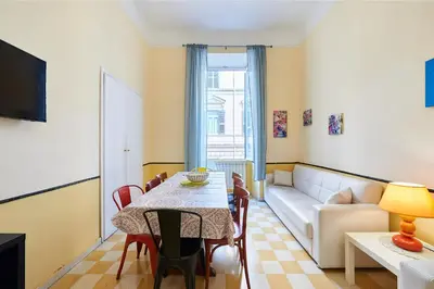 a living room with a table and a couch at Casa al Viminale in Rome