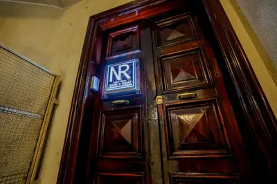 a wooden door with a sign on it at Noemi's Rooms Guest House in Rome
