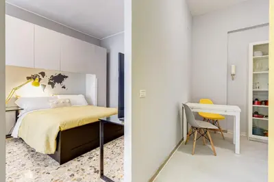 a bedroom with a bed and a desk and a chair at BDC - King Termini Apartment in Rome