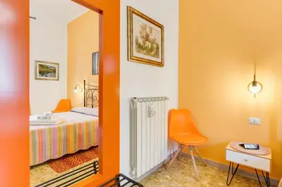 a room with a bedroom with a bed and a mirror at 2 Passi Al Colosseo B&B in Rome