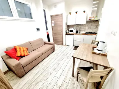 a living room with a couch and a table at New Tiburtina in Rome