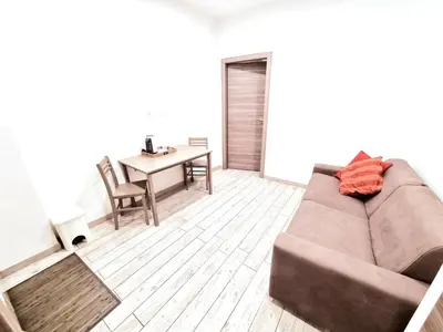 a living room with a couch and a table at New Tiburtina in Rome