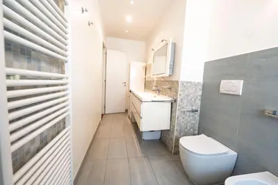 a bathroom with a toilet and a sink at St Peter new and lightsome apartment with balcony in Rome