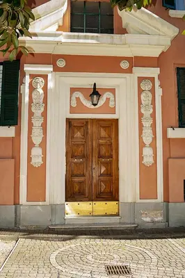 a wooden door on the side of a building at Il Bonsai B&B in Rome