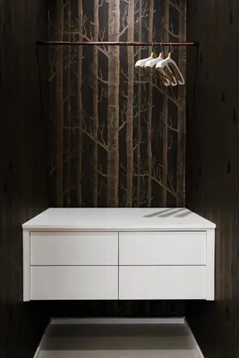 a white dresser in a room with a wall at Numa Roma Guesthouse in Rome