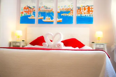 a bedroom with a bed with a stuffed animal on it at Casa Martini in Rome