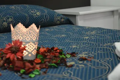 a toy crown sitting on top of a bed at Locanda Otello in Rome