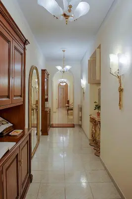 a large kitchen with a ceiling fan and a hallway at Armonia All'Opera in Rome