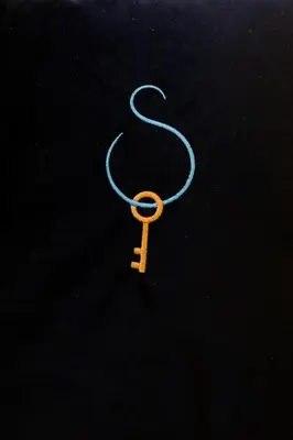 a small orange key on a blue string at A World Aparts - 40 Sforza in Rome