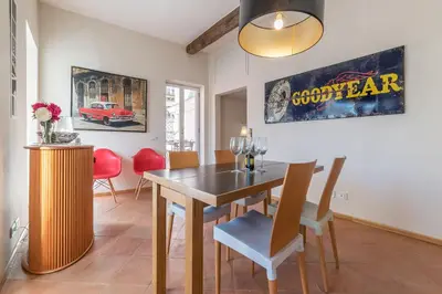 a dining room with a table and chairs at Monti Stunning Apartment with Terrace in Rome
