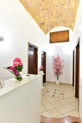 a bathroom with a counter and flowers in a room at B&B Rome Terminal House in Rome