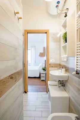 a bathroom with a toilet and a sink at Luma Home in Rome