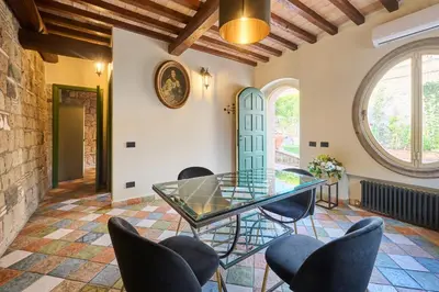 a dining room with a glass table and chairs at Domus Luxury Gianicolo in Rome