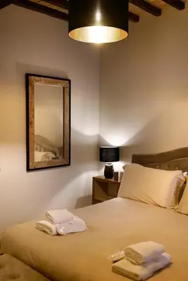 a bedroom with a bed with two towels on it at Domus Luxury Gianicolo in Rome