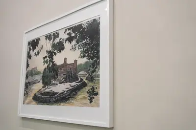 a picture of a painting of a boat on a river at Casa De Rose in Rome