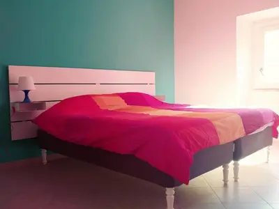 a bedroom with a large bed with a red blanket at Roma TouristHome via palestro 56 in Rome