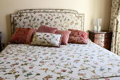 a bedroom with a bed with pillows on it at Rome Kings Suite in Rome