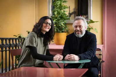 a woman and a man sitting at a table at Hotel Oceania in Rome