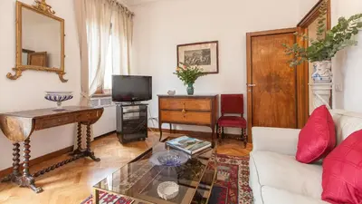 a living room with a couch and a table at Rental In Rome Ancient View in Rome